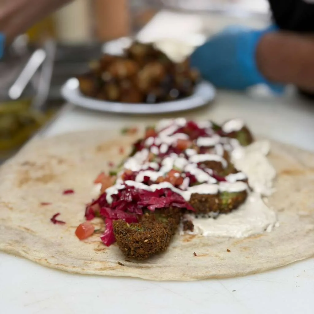 Falafel wrap with pickled vegetables and tahini