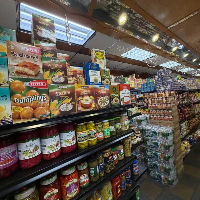 International grocery aisles with pickled vegetables, flours, and pantry staples