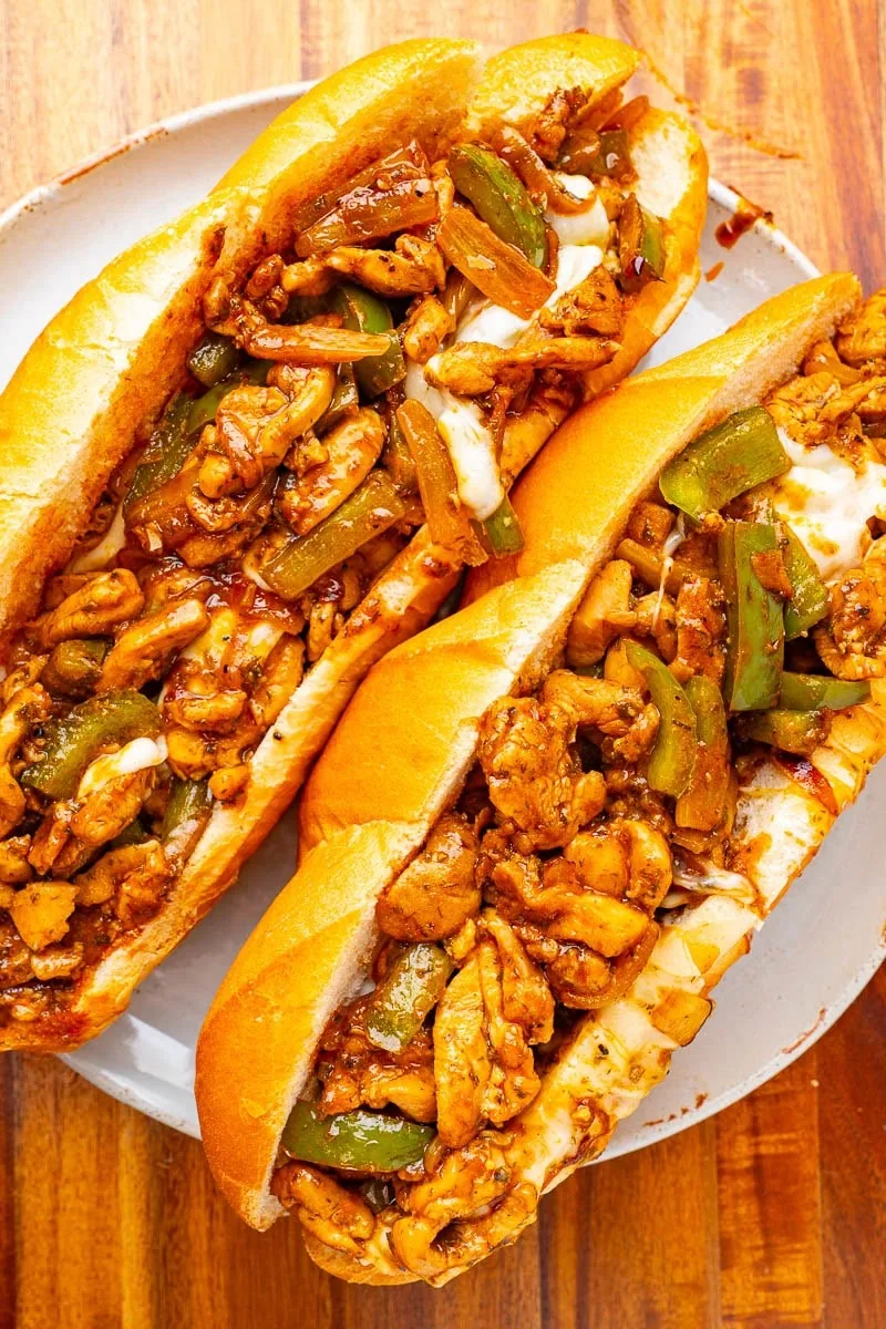 Chicken Philly sandwiches with peppers, onions, and melted cheese