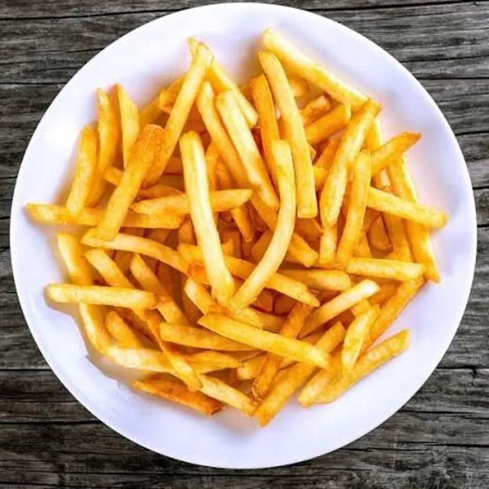A plate of golden french fries