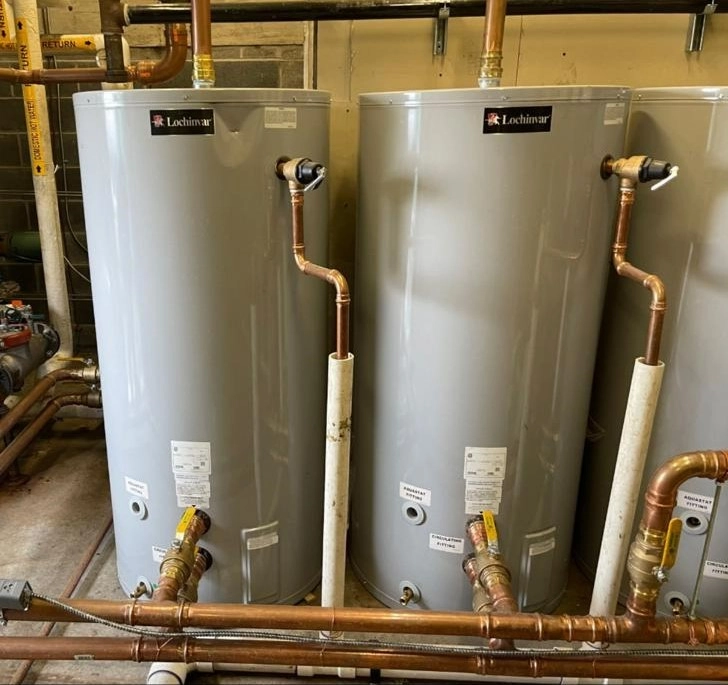 Dual Lochinvar commercial water heaters with copper piping